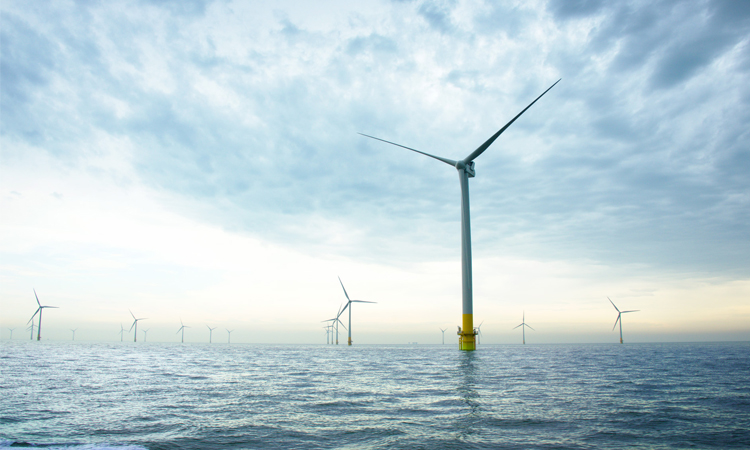 Windmill standing in the sea (photo)